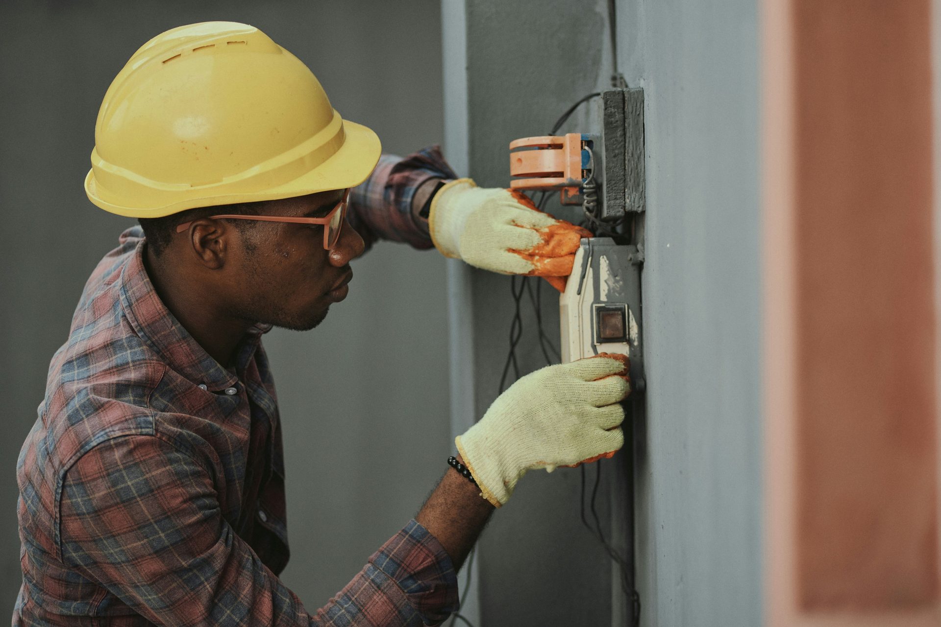 An electrical trainee working on site in New Zealand